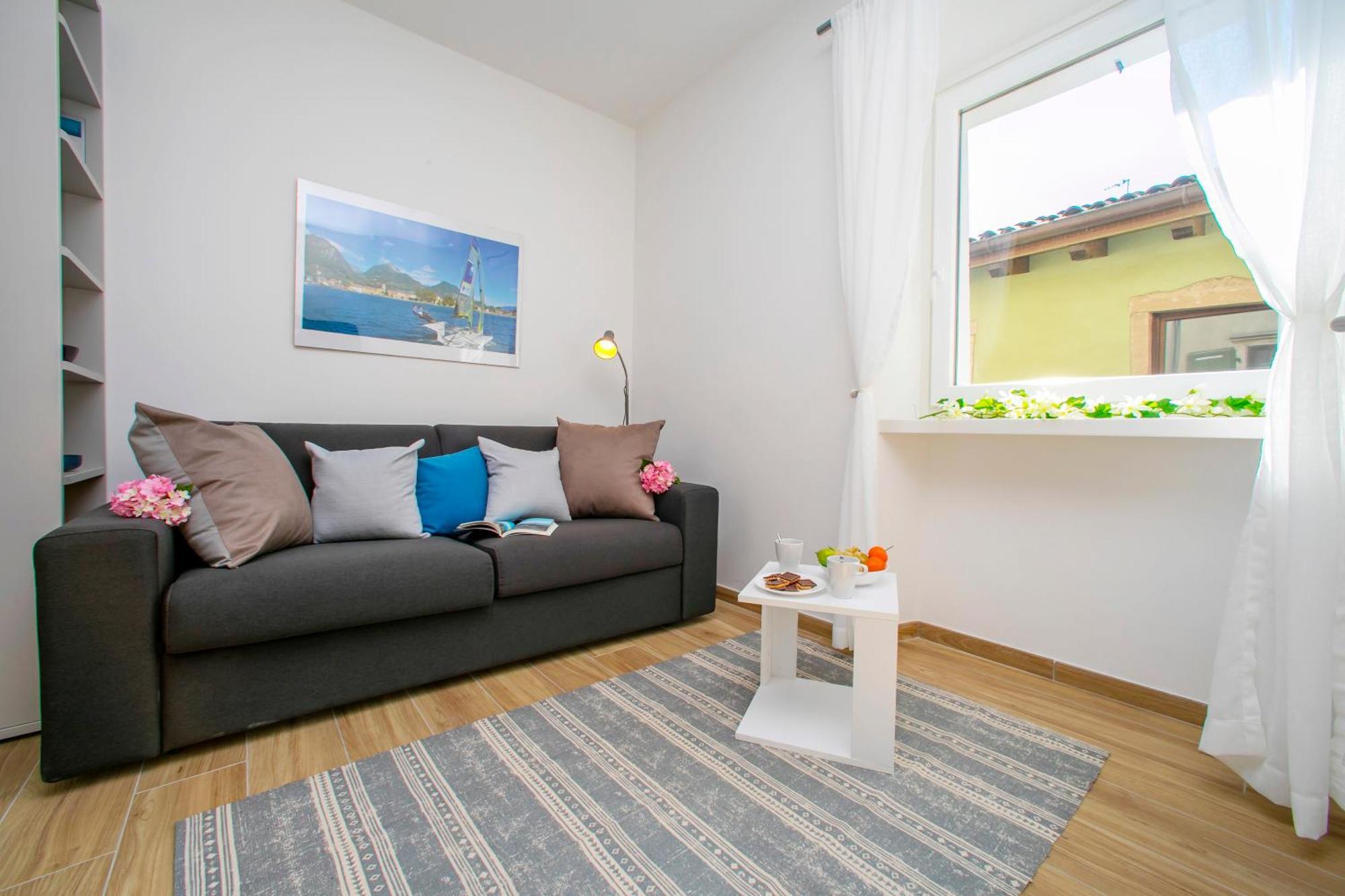 Nido Sui Tetti Di Riva Del Garda - Happy Rentals 외부 사진