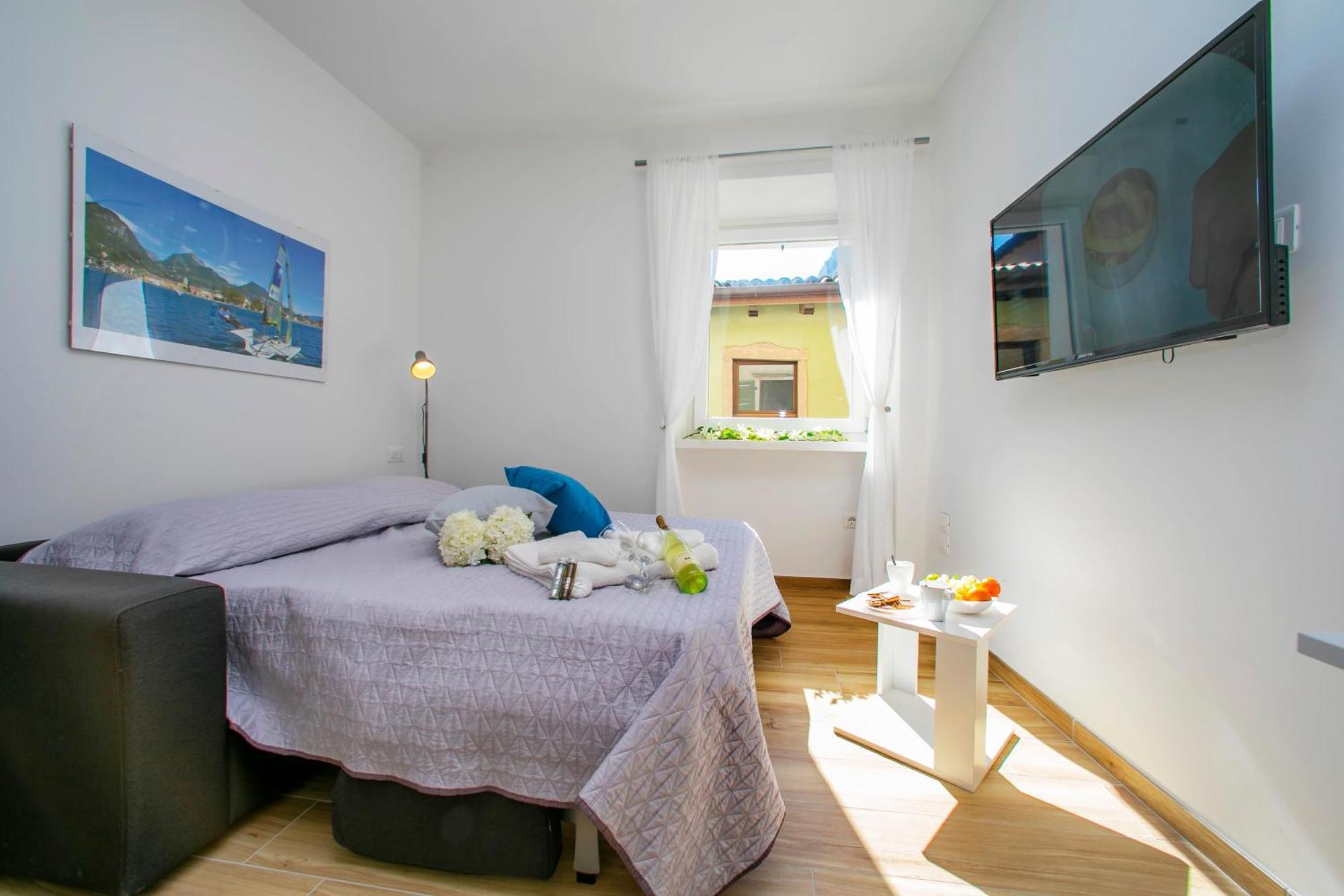 Nido Sui Tetti Di Riva Del Garda - Happy Rentals 외부 사진